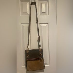 Hammett crossbody tan and gray leather with red interior. Used condition.